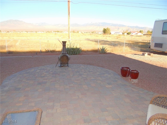 view of patio / terrace featuring a mountain view