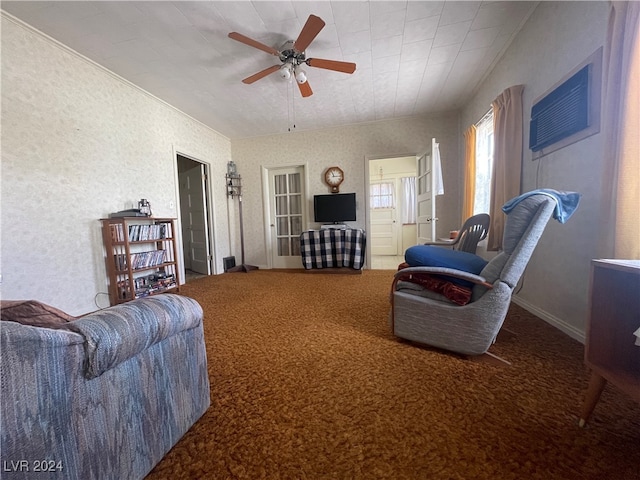 carpeted living room with ceiling fan