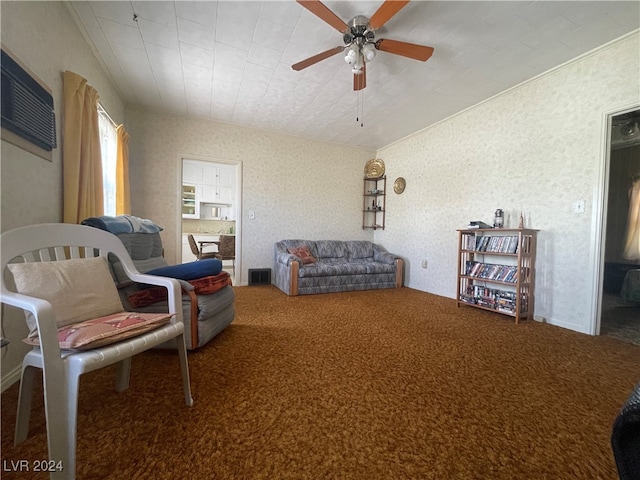 sitting room with carpet and ceiling fan