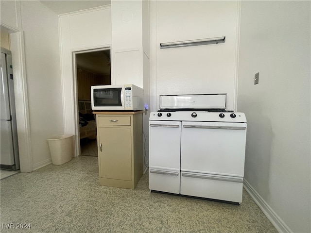 kitchen with stainless steel fridge and stove