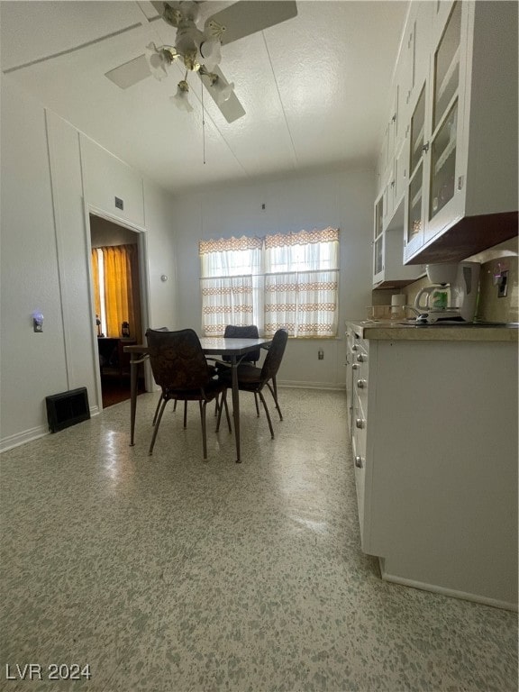 dining area with ceiling fan