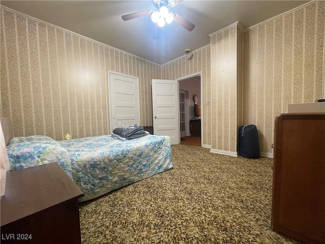 carpeted bedroom featuring ceiling fan and ornamental molding