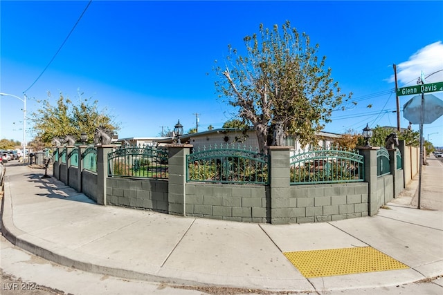 view of gate featuring a fenced front yard