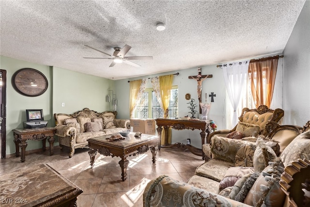 living area featuring a textured ceiling, ceiling fan, and tile patterned flooring