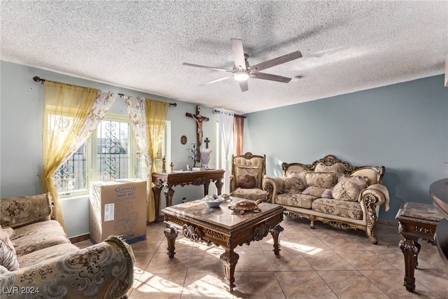 tiled living room with a textured ceiling and ceiling fan