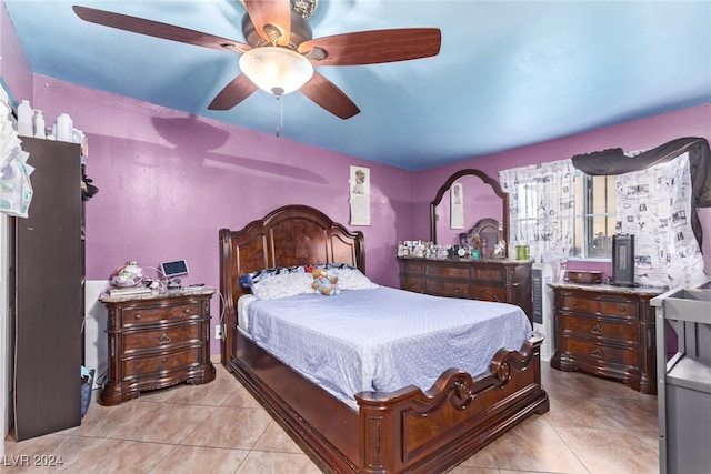 bedroom featuring light tile patterned floors and ceiling fan