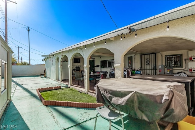 back of house with a patio area, stucco siding, and fence