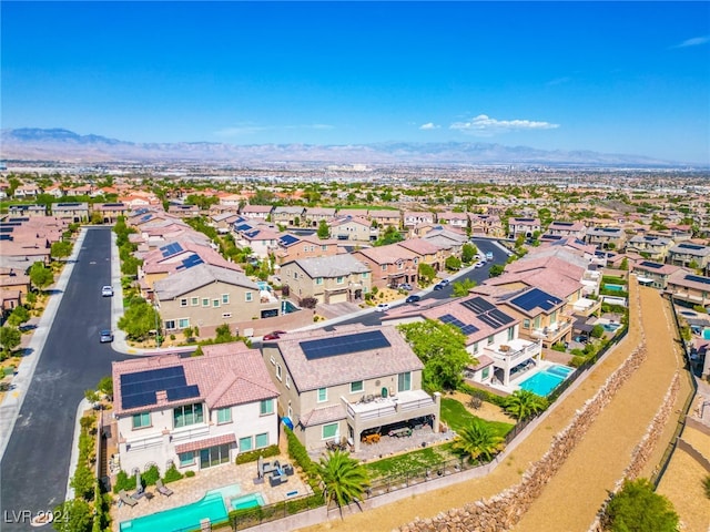 birds eye view of property featuring a mountain view