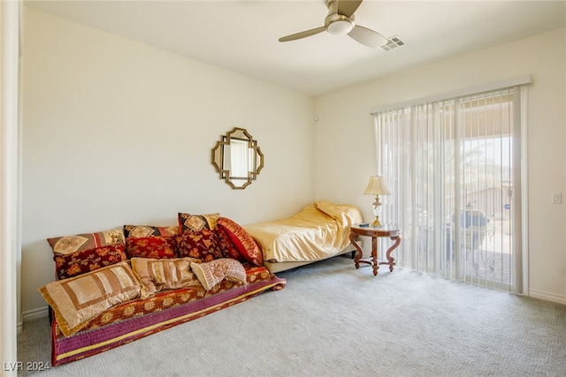 carpeted bedroom with ceiling fan and access to exterior