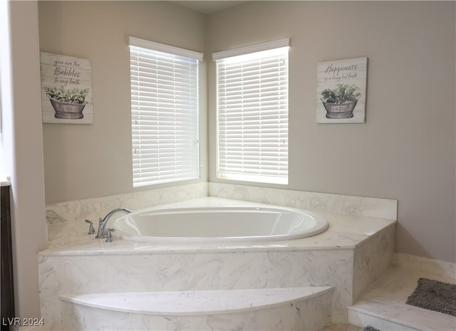 bathroom with a tub