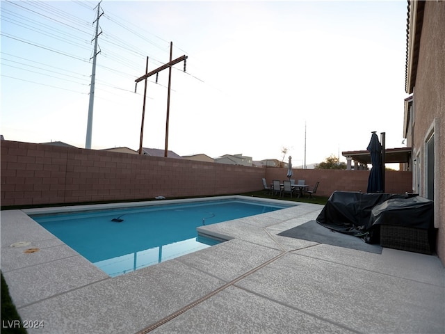 view of pool with grilling area