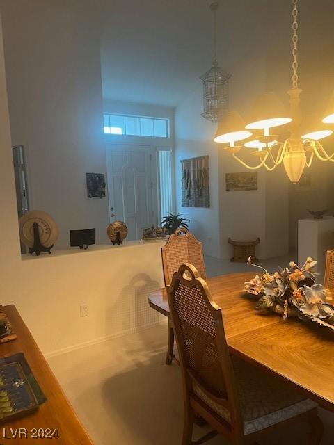 dining space featuring a notable chandelier