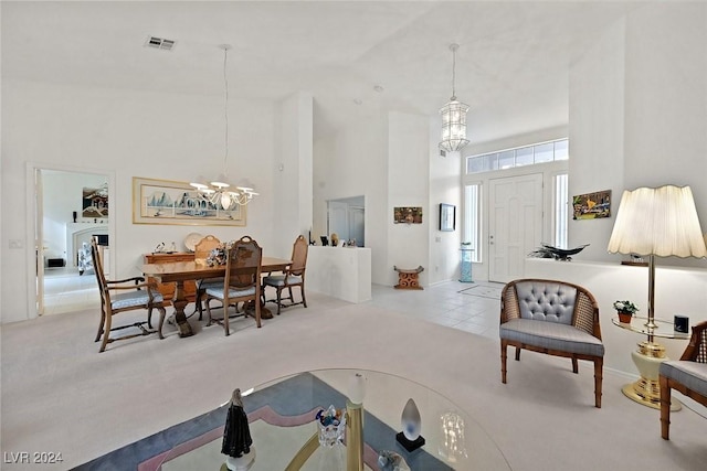 interior space featuring light carpet and a high ceiling