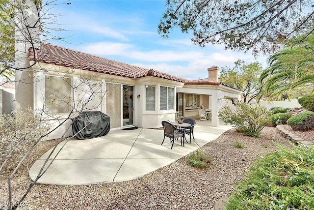 rear view of property with a patio