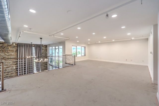 unfurnished room featuring concrete flooring