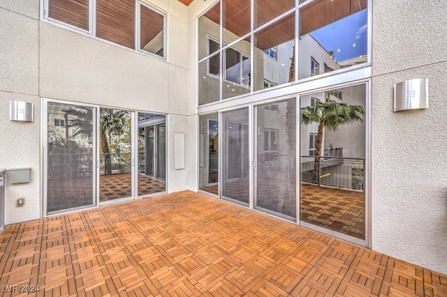 unfurnished sunroom with vaulted ceiling