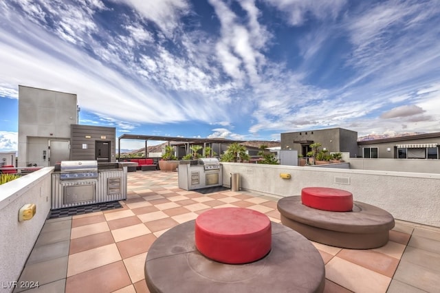 view of patio / terrace featuring area for grilling and exterior kitchen