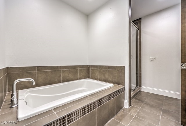 bathroom with tile patterned floors and separate shower and tub