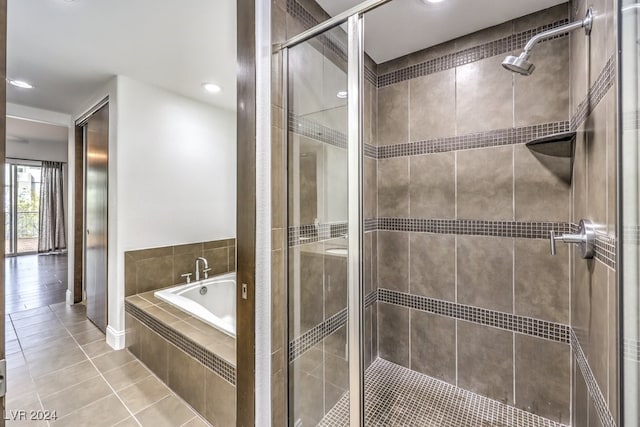 bathroom with tile patterned floors and plus walk in shower