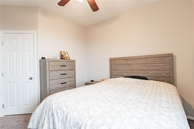 bedroom with carpet floors, vaulted ceiling, and ceiling fan