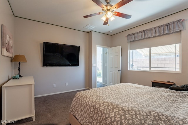 bedroom with dark carpet and ceiling fan