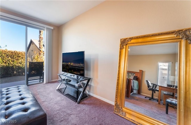 carpeted living room with lofted ceiling