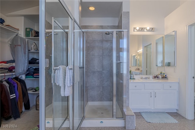 bathroom with vanity and an enclosed shower