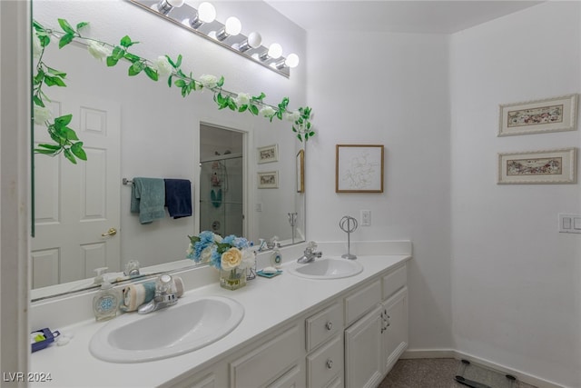 bathroom featuring vanity and a shower with shower door