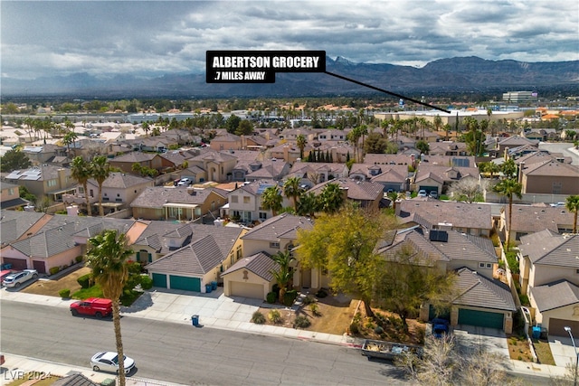 birds eye view of property featuring a mountain view