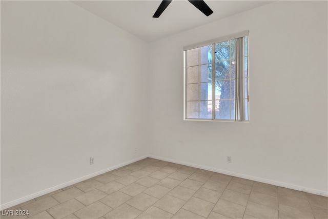 empty room featuring ceiling fan and light tile patterned flooring