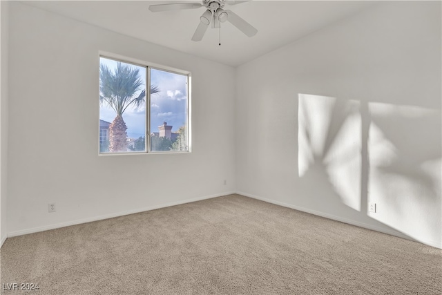 spare room with carpet and ceiling fan