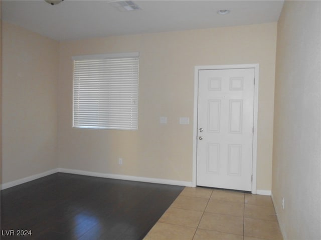 spare room with light hardwood / wood-style flooring