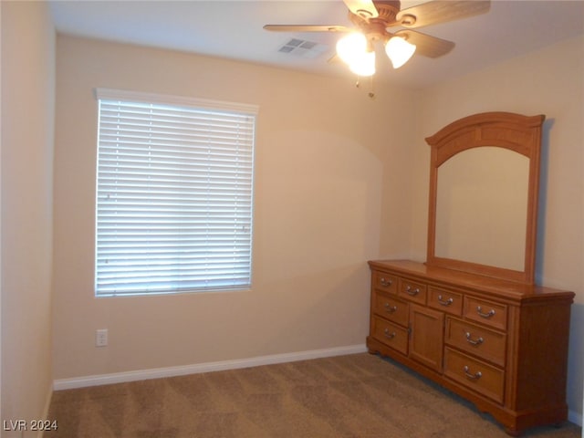 unfurnished bedroom with ceiling fan and light carpet