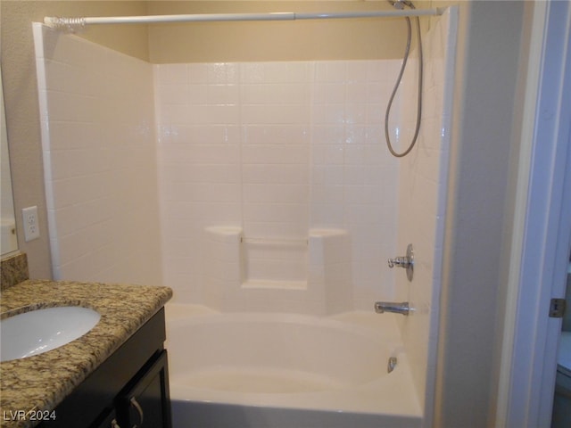 bathroom featuring shower / tub combination and vanity