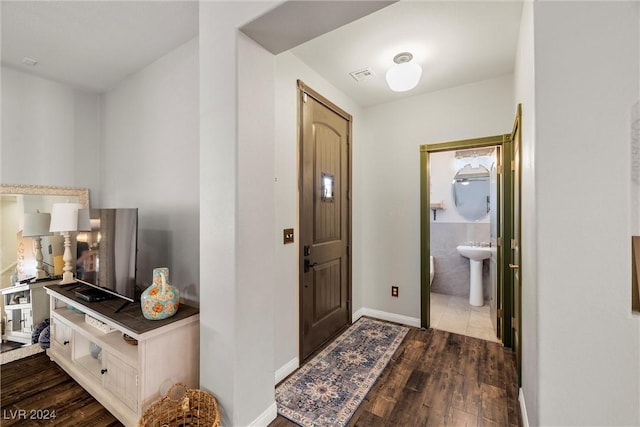 entryway featuring sink and hardwood / wood-style floors