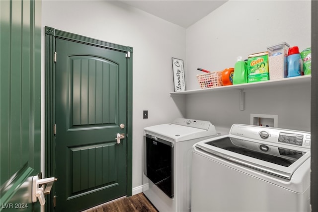 laundry area with dark wood-type flooring and washer and dryer