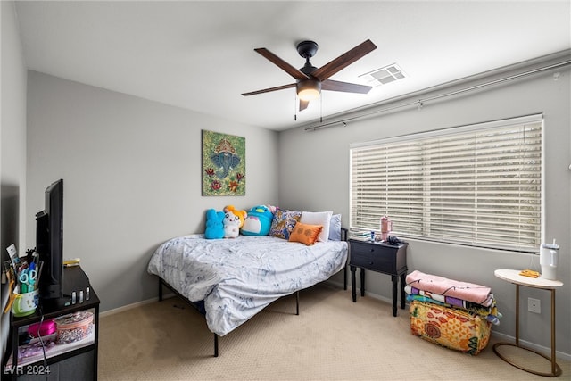 carpeted bedroom with ceiling fan