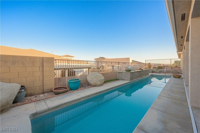 view of pool featuring a fenced in pool and a fenced backyard