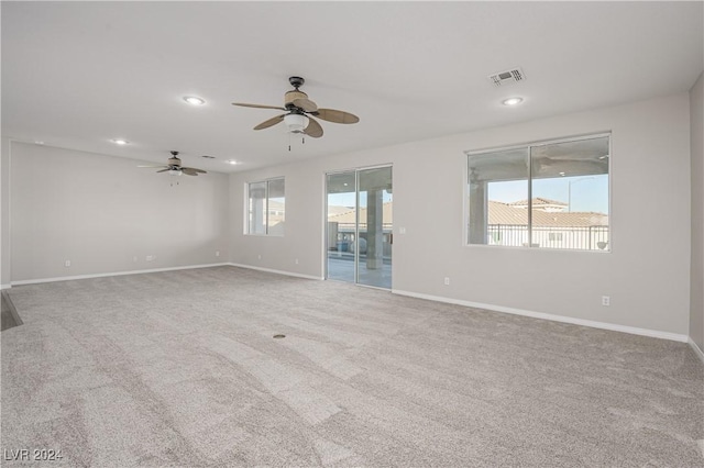 spare room featuring recessed lighting, visible vents, baseboards, and carpet