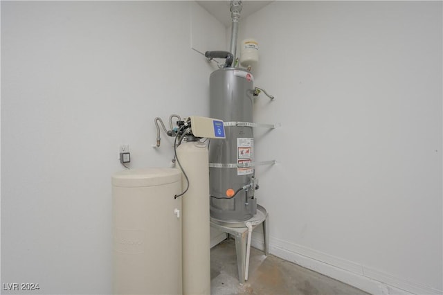 utility room with secured water heater