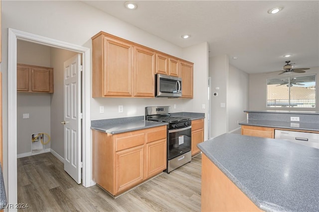 kitchen with baseboards, light wood finished floors, recessed lighting, ceiling fan, and appliances with stainless steel finishes