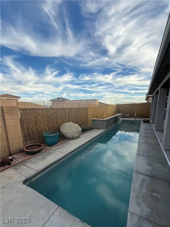 view of pool with a fenced in pool and a fenced backyard