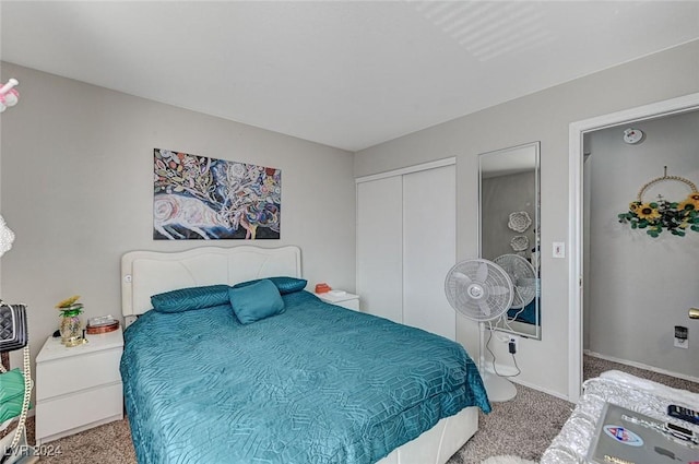 carpeted bedroom with a closet