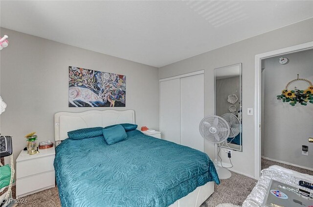 6796 Pacific Craft Ln, Las Vegas, NV 89122 - carpeted bedroom with a closet and baseboards