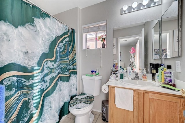 bathroom with tile patterned floors, vanity, and toilet