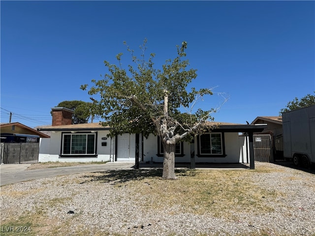 single story home with a porch