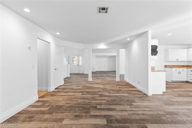 unfurnished living room featuring hardwood / wood-style flooring