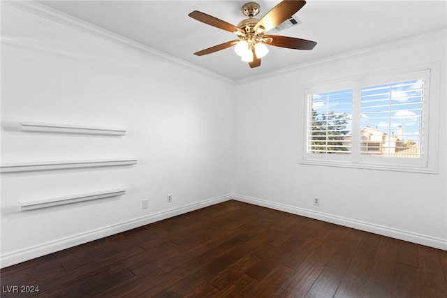 spare room with ceiling fan, ornamental molding, and dark wood-type flooring