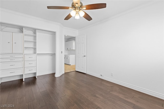 unfurnished bedroom with a closet, crown molding, ceiling fan, and dark wood-type flooring