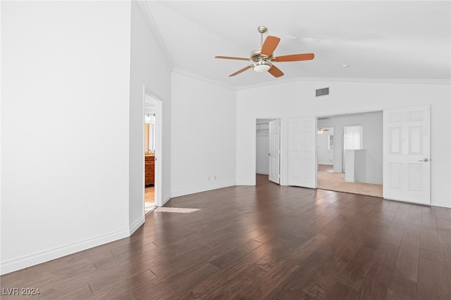 interior space with lofted ceiling, dark hardwood / wood-style flooring, ceiling fan, and crown molding